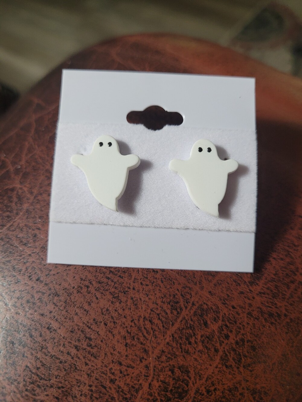 A pair of Smooth White Ghosts lightweight matte polymer clay or resin earrings